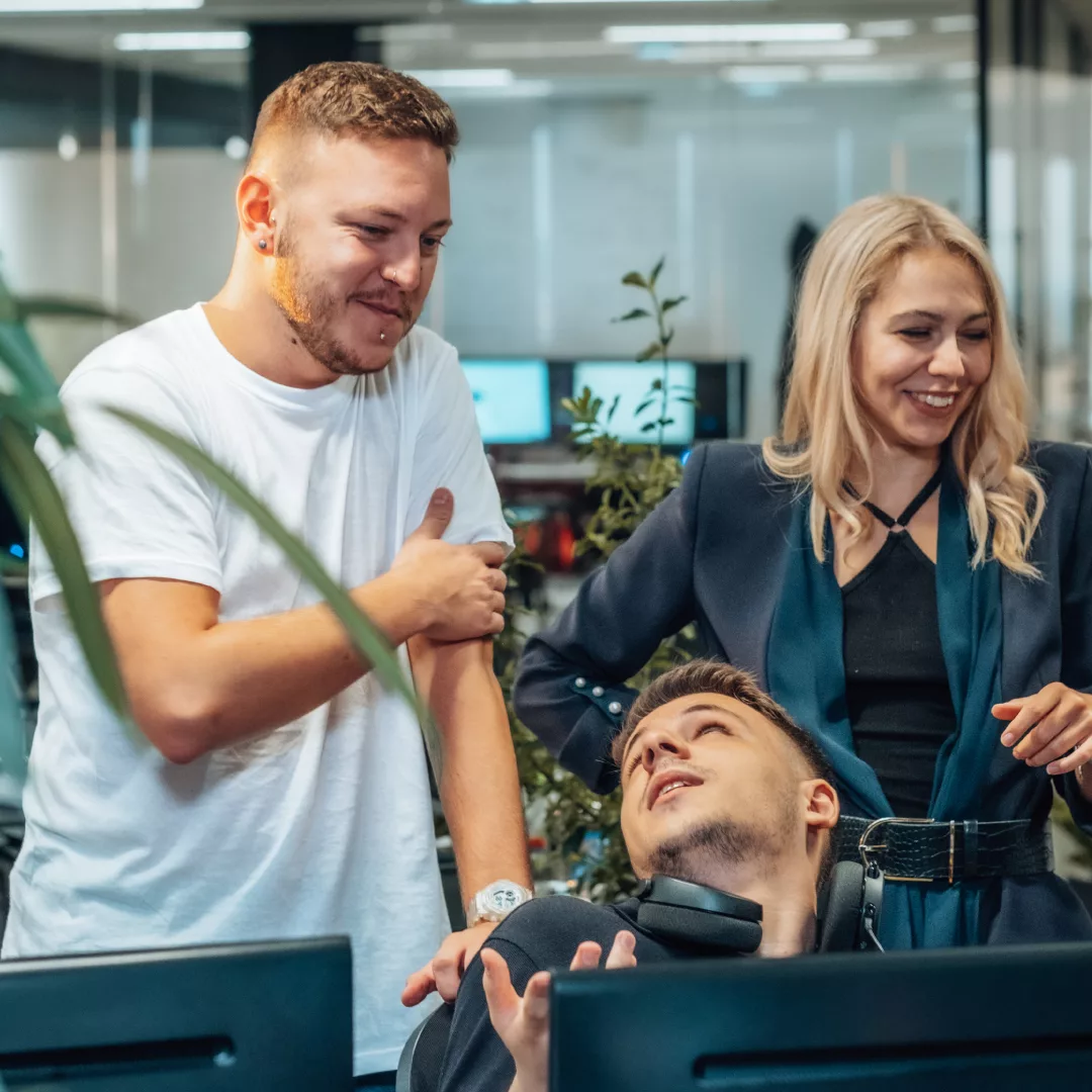People in an office working and having fun