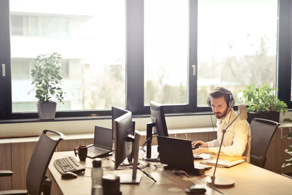 A man sitting in an office having a call with a customer