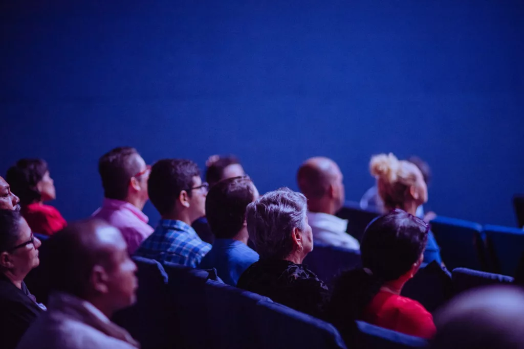 People sitting in a crowd